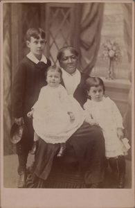 JOHN B. WORTHAM (American, 1838-1889), [African American Woman (Nanny) & Three White Children], cabinet card, late 19th century, 4 1/4 x 6 1/2 in. (10.8 x 16.51 cm), Museum Purchase, Gridley W. Tarbell II Fund, 2020.22.3.