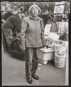 ACCRA SHEPP (American, born 1962), Colette, Occupying Wall Street, November 5, 2011, 2011- 2012 gelatin silver print, 20 x 16 in. (50.8 x 40.64 cm), Museum Purchase, Lloyd O. and Marjorie Strong Coulter Fund, 2015.18.5. © Accra Shepp