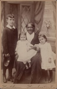 JOHN B. WORTHAM (American, 1838-1889), [African American Woman (Nanny) & Three White Children], cabinet card, late 19th century, 4 1/4 x 6 1/2 in. (10.8 x 16.51 cm), Museum Purchase, Gridley W. Tarbell II Fund, 2020.22.2.