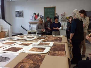 students looking at prints